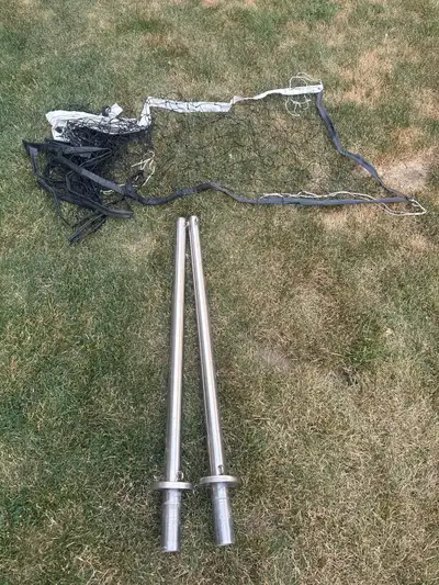 Swimming pool volleyball net with posts. Was installed on a 20’ wide pool. $20