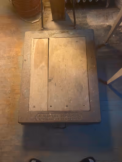 Antique large platform scale. Metal and wood construction.Would have been used in a warehouse and li...