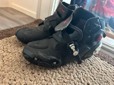 I'm selling a pair of used black Pro Biker motorcycle riding boots, perfect for providing protection...