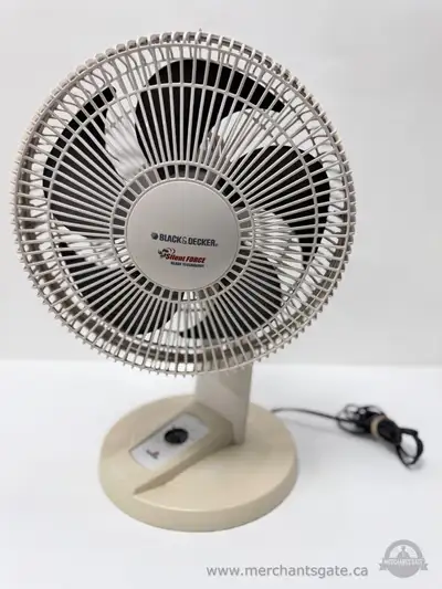 Black and Decker Silent Force tabletop fan with circular safety grille and three blade design. Featu...