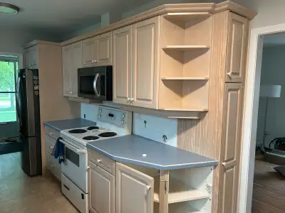 I am giving away a set of used kitchen cabinets and drawers. They are a light wood colour and have s...