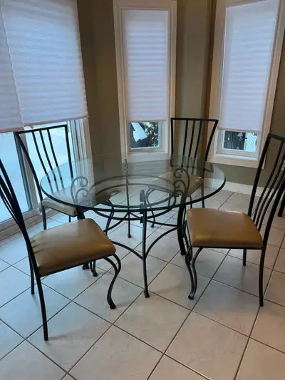 Dining room set includes 1 table and 4 chairs. Table: excellent condition. Tempered beveled glass ta...