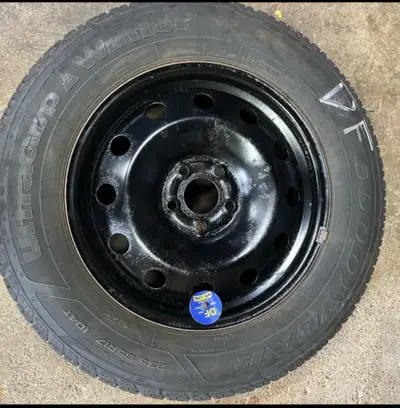 I'm selling a set of 4 Goodyear UltraGrip Winter tires, size 235/65R17 104T, mounted on a black stee...