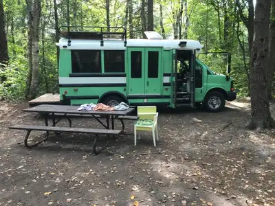 Converted Mini-schoolbus camper . Very low miles 6.0 L gas V8 Chevy 3500 with new tires and brakes a...