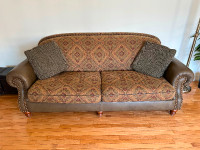 Couch with leather armrest and two matching chairs