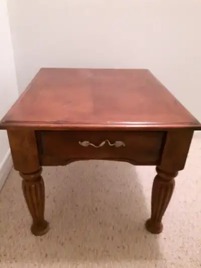 Wood End Table with drawer and beautifully carved legs. Decorative leaf handle. Stylish, suited for...