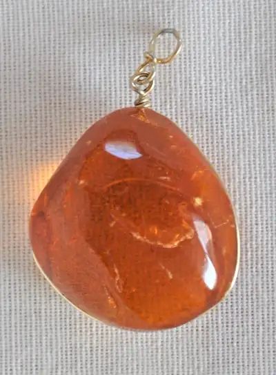GENUINE BALTIC AMBER PENDANT - Gorgeous translucent honey colour - 5 cm long including the bail - Bi...