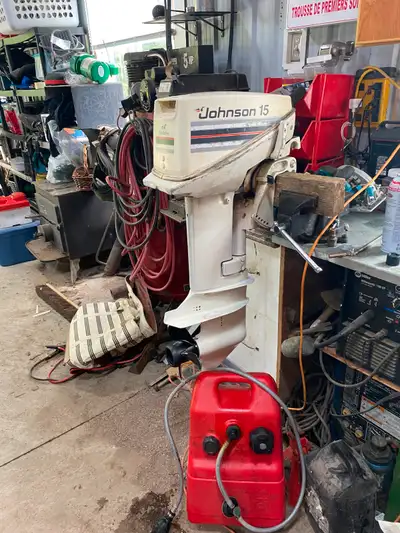 15 hp Johnson outboard. Good running condition. C/W tank and hose.