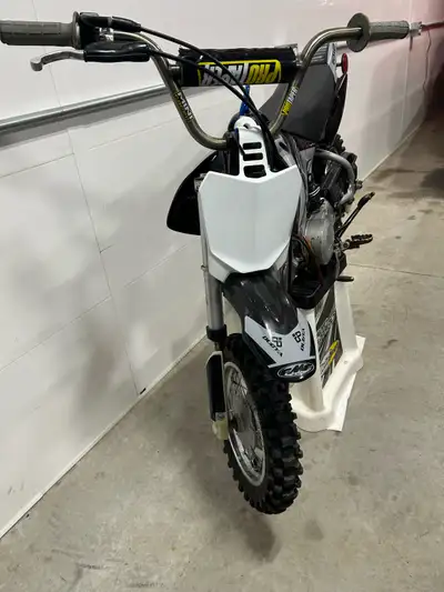 2006 honday crf50, great running bike. New carb, training wheel bar can go with. Pro taper bars and...