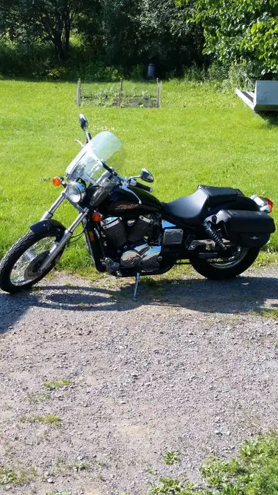 750 Honda shadow stock with windshield, saddle bags, and passenger back rest . Needs nothing to cert...