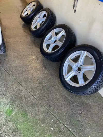 Set of 4 Michelin 225/55R18 winter tires mounted on clean alloy wheels. Excellent tread, no damage,...