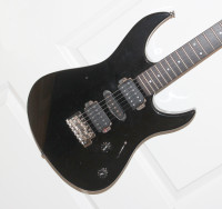 Black Yamaha Superstrat 121D electric guitar.