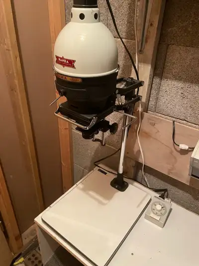 I am selling a complete darkroom setup, including a Hansa darkroom enlarger with timer, Ilford safel...