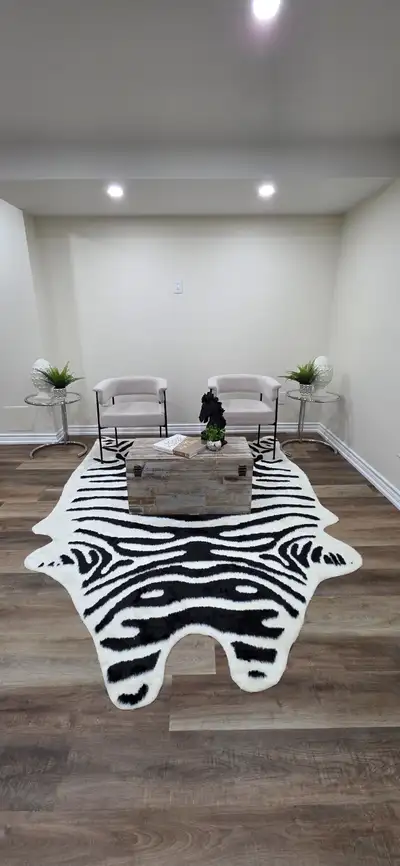 Black and white zebra print rug, plush material., View more