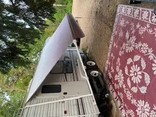 8 x 13 foot camper awning. Excellent condition,barely used. 70 inch hitch for camper to tow boat or...