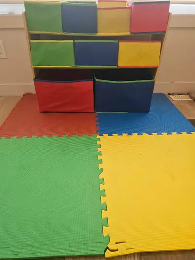 A wooden shelf with colourful fabric bins. Various sizes. Great for kids to keep their toys organize...