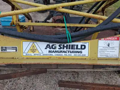 This pre-owned Ag Shield hay tedder is designed to efficiently spread and aerate hay for faster dryi...