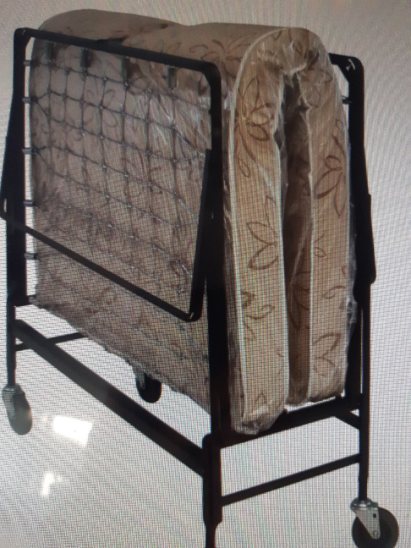 Foldout cot on wheels + mattress. in Beds & Mattresses in Edmonton