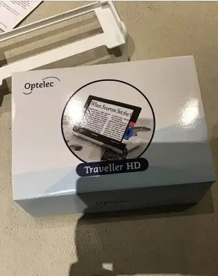 Optolect Traveler HD utilisé environ 10 fois. inclus le support pour lecture de livre ou journeaux