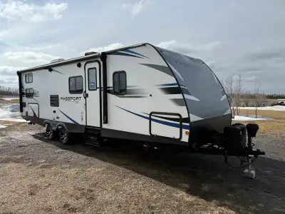 2021 KEYSTONE PASSPORT 267BH Travel trailer for sale. In very good condition. Winterized every fall...
