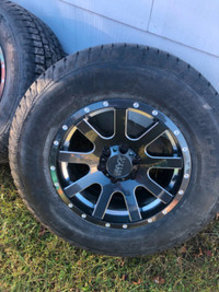 Cooper winter tires on rims off a Ford F150