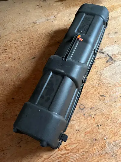 Hard plastic with wheels. Lockable. Perfect for air travel. Used once.