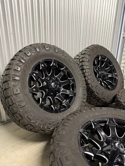 18x9” (+1 offset) Fuel “Battle Axe” 5x127 + 5x114.3 bolt pattern rims + 33x12.5R18LT Nitto Ridge Gra...