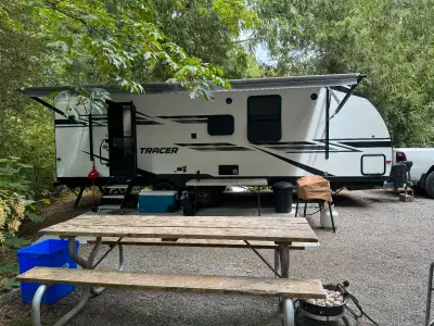 Hardly used, stored indoors in winter, 2 slides. King size bed. Home theater seating - could be take...