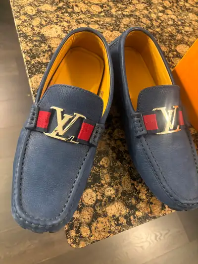 Men’s Blue Designer-Style Loafers Navy blue slip-on loafers with a pebbled leather look and classic...