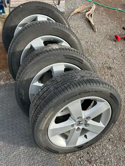 Honda Civic (2015) factory aluminum rims and 205/55/R16 Continental all season tires for sale, plus...