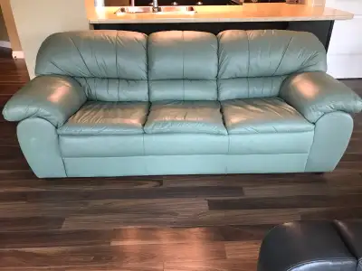 Light green leather couch Dimensions: 6' 11" long - 35" deep - 33" high (back) - 18" high (seat) Loo...