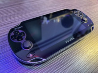 Sony PS Vita (PCH-1001) + Charger, Case, and More!