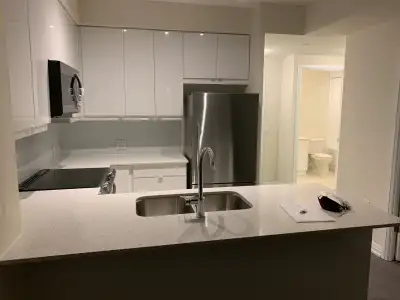 This modern, light-filled 1-bedroom condo offers contemporary living with its sleek, white-cabinet k...