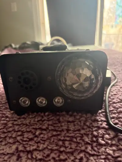 Add some groovy vibes to your next party with this disco light! This compact, once used party light...