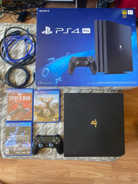 Sony PlayStation 4 pro with box and games