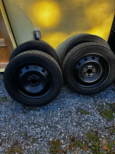 These are a set of General Altimax Arctic 12 winter tires, already mounted on rims. They are used bu...