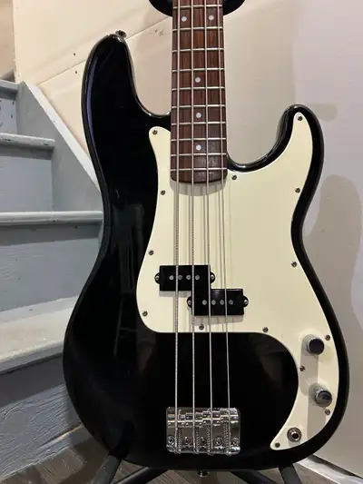 For sale is a 2000 - 2001 Squier P Bass finished in black. It's in really good condition for it's ag...
