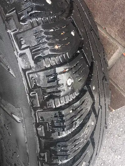 Selling a complete set of 4 Nokian Nordman 5 SUV studded winter tires, already mounted on 16-inch bl...