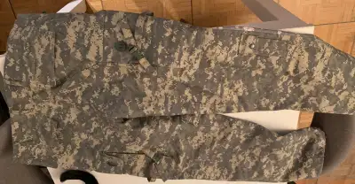 Camouflage cargo pants with multiple pockets. Brand new. Original German army item from Miltec Size...