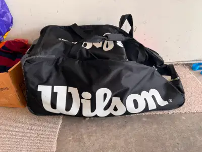 Wilson tour bag on wheel with ice hockey accessories, View more