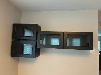 Dark brown IKEA BESTA cabinets with glass panel doors Like new condition Mounts to wall Double: 47”...