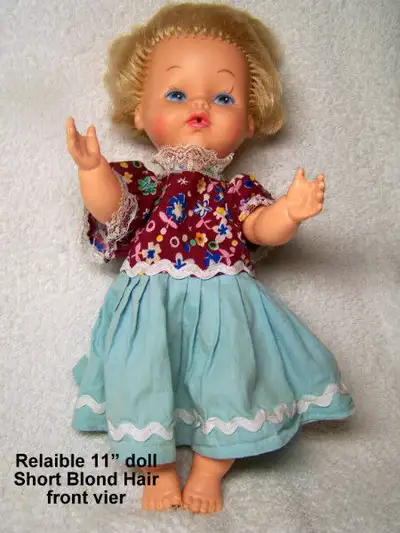 Vintage Reliable doll, short blond hair, blue eyes, pink skin, View more
