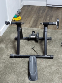 Bike trainer stand and front wheel holder.