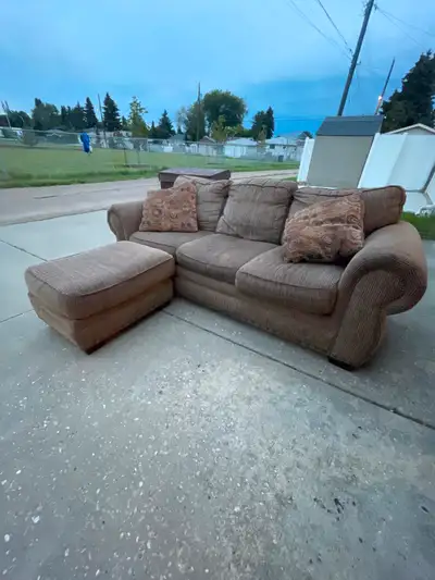 Three-seat couch with matching ottoman and throw pillows, View more