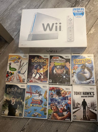 Wii in box, with 8 games