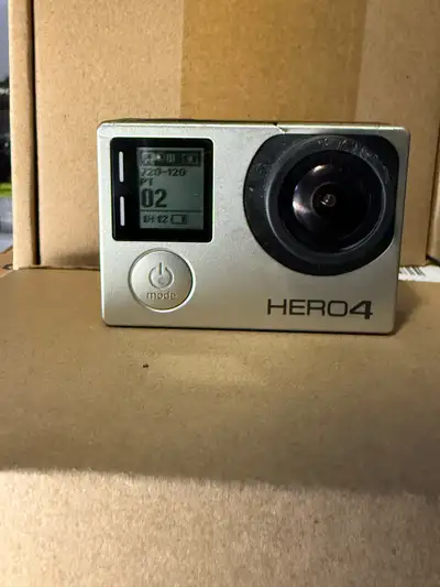 GoPro hero 4 black edition Has some damage to the frame but still works 100% as it should Lens is sc...