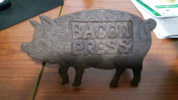 Vintage cast iron pig shaped bacon press.