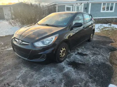 2014 Hyundai accent. 178xxxkms, auto. Heated seats, winter tires. cracked windshield. Mvi. $3000