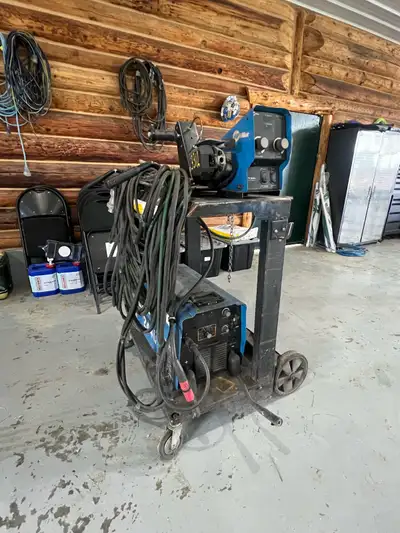 2018 miller xmt 450 cc/cv with 70 series wire feeder. Comes with regulator, double bottle cart and a...