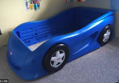 Twin Size Navy Blue race car bed. This bed has been a favourite in our home! Perfect for transition...